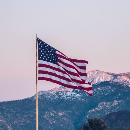 The flag of the United States at sundown.